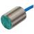 Zylindrischer, metallischer Sensor mit blauer Verkabelung, auf grünem Etikett technische Spezifikationen, CE-Kennzeichnung sichtbar.