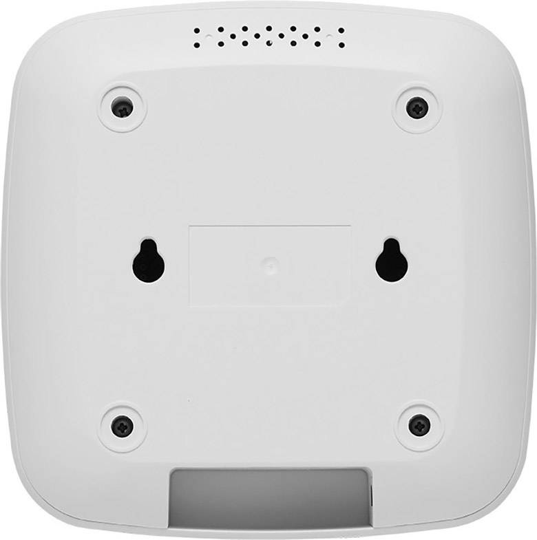 Die Unterseite eines weißen elektronischen Geräts mit vier Schrauben und zwei Aufhängelöchern. Oben sind Lüftungsschlitze sichtbar.