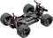 Ein ferngesteuertes Auto-Chassis mit großen, grobstolligen Reifen und rot schimmernden Stoßdämpfern, ohne Karosserie.
