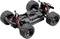Ferngesteuertes Auto-Chassis mit robusten, grob profilierten Reifen und sichtbaren Stoßdämpfern. Geeignet für Offroad-Fahrten.