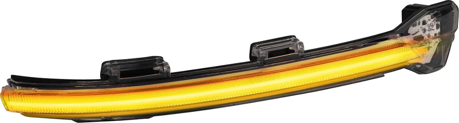 Ein dynamischer Blinker mit leuchtendem LED-Streifen. Er ist lang und schmal, in einem transparenten Gehäuse montiert.