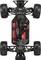 'Obere Ansicht eines RC-Auto-Chassis mit Elektronik, Batterien und offenen Radaufhängungen. Robuste, profilierte Reifen sind sichtbar.'