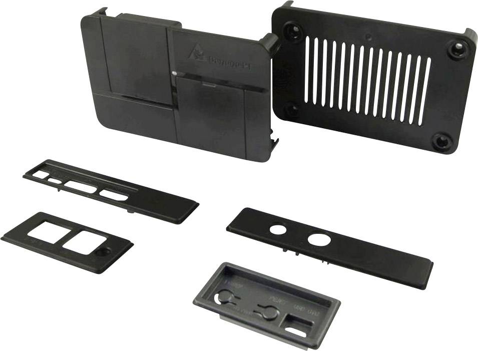 Mehrere schwarze Kunststoffgehäuse und Abdeckplatten für Elektroinstallationen, mit Öffnungen für Schalter und Steckdosen.