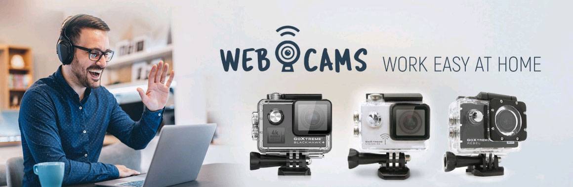 Ein Mann mit Kopfhörern lächelt und winkt vor einem Computer. Daneben sind drei Webcams abgebildet mit dem Text 'Webcams: Work Easy at Home'.