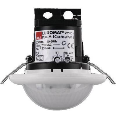 Ein LUXOMAT Bewegungsmelder mit technischen Spezifikationen auf Etikett: 230VAC, 50-60Hz, 5A. Design für Deckenmontage.