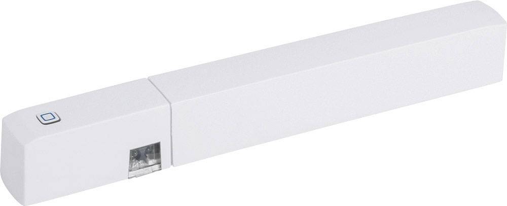 Ein weißer, länglicher Sensor mit einem kleinen Knopf und einem durchsichtigen Abschnitt für Verbindungen, möglicherweise ein Tür- oder Fensterkontakt.