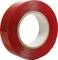 Eine Rolle rotes Klebeband, spiralförmig aufgewickelt, auf einem hellen Hintergrund.