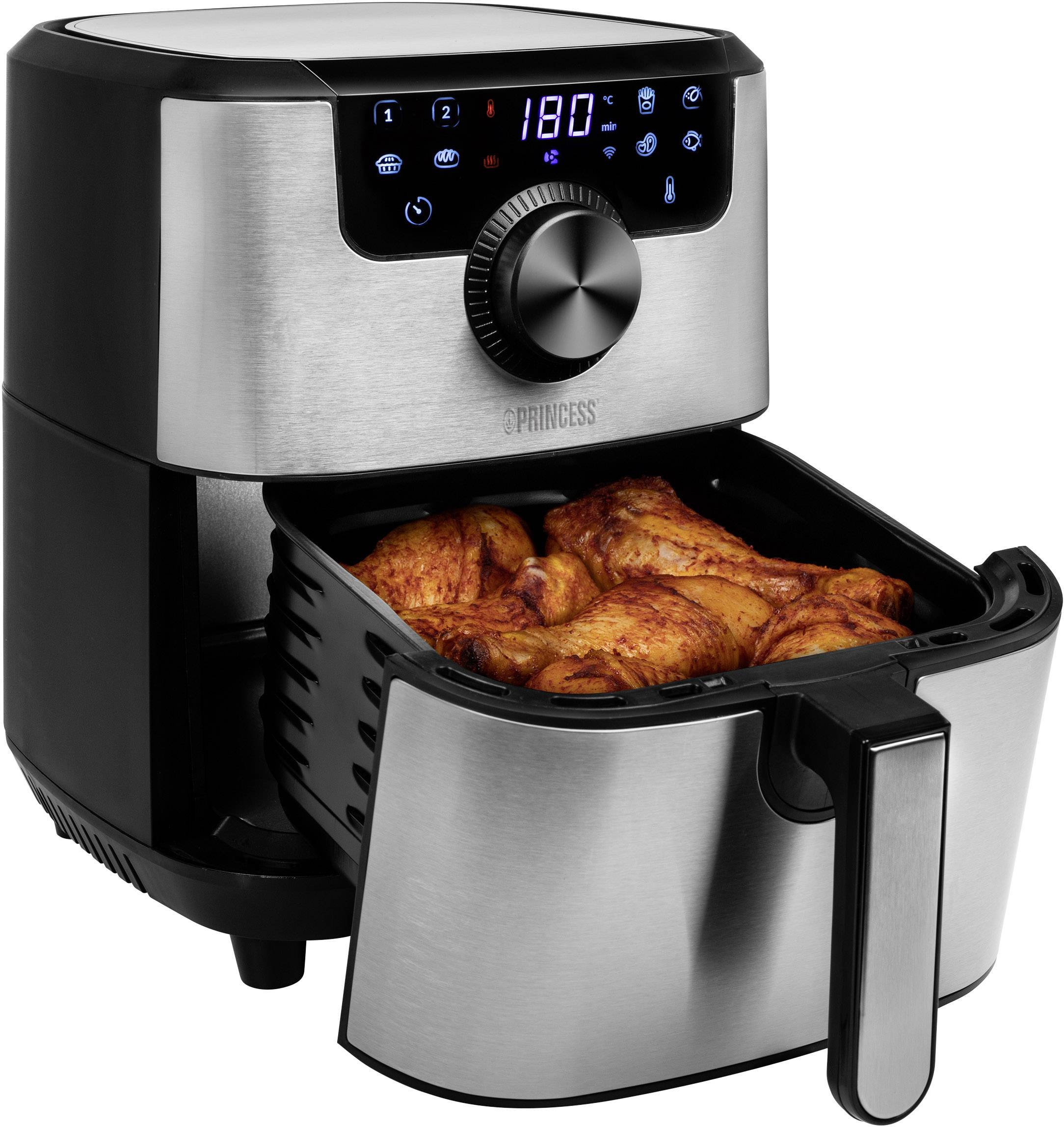 Eine Heißluftfritteuse mit digitalem Display zeigt die Temperatur von 180°C. Der Korb ist gefüllt mit gebratenen Hühnchenteilen.