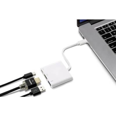 Ein Laptop ist über einen Adapter mit drei Kabeln verbunden: HDMI, USB und Netzteil. Der Adapter liegt neben dem Laptop.