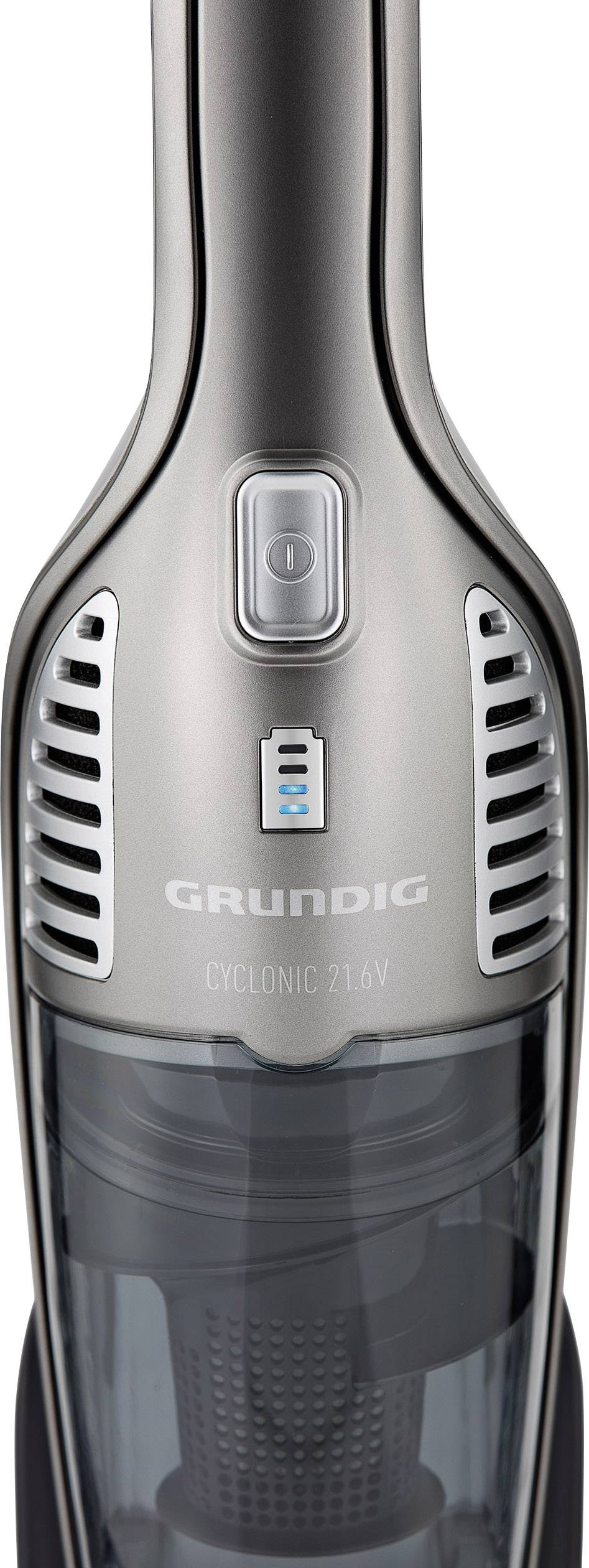 Ein silberner kabelloser Staubsauger von Grundig mit der Aufschrift 'CYCLONIC 21.6V'. Sichtbar ist der obere Teil mit Power-Schalter.