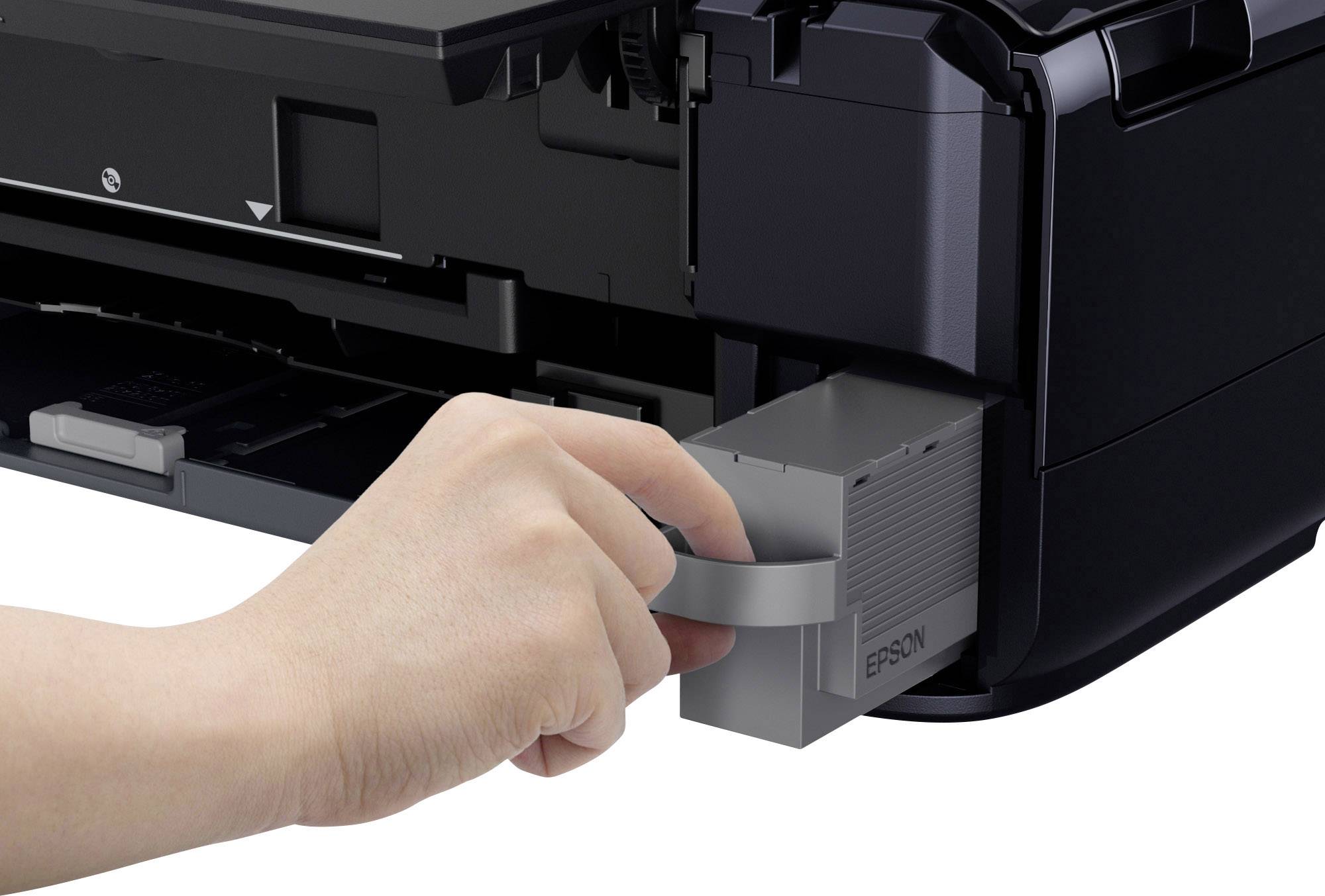 'Hand entfernt Tintentank aus einem Drucker.'