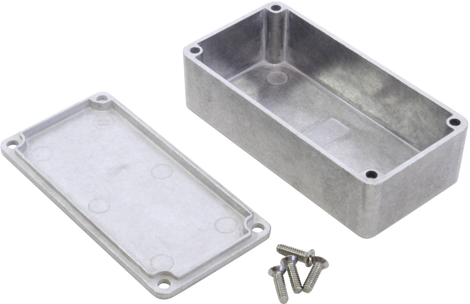 Metallisches Gehäuse in rechteckiger Form, offen mit separater Abdeckung und vier losen Schrauben, auf einer weißen Oberfläche.