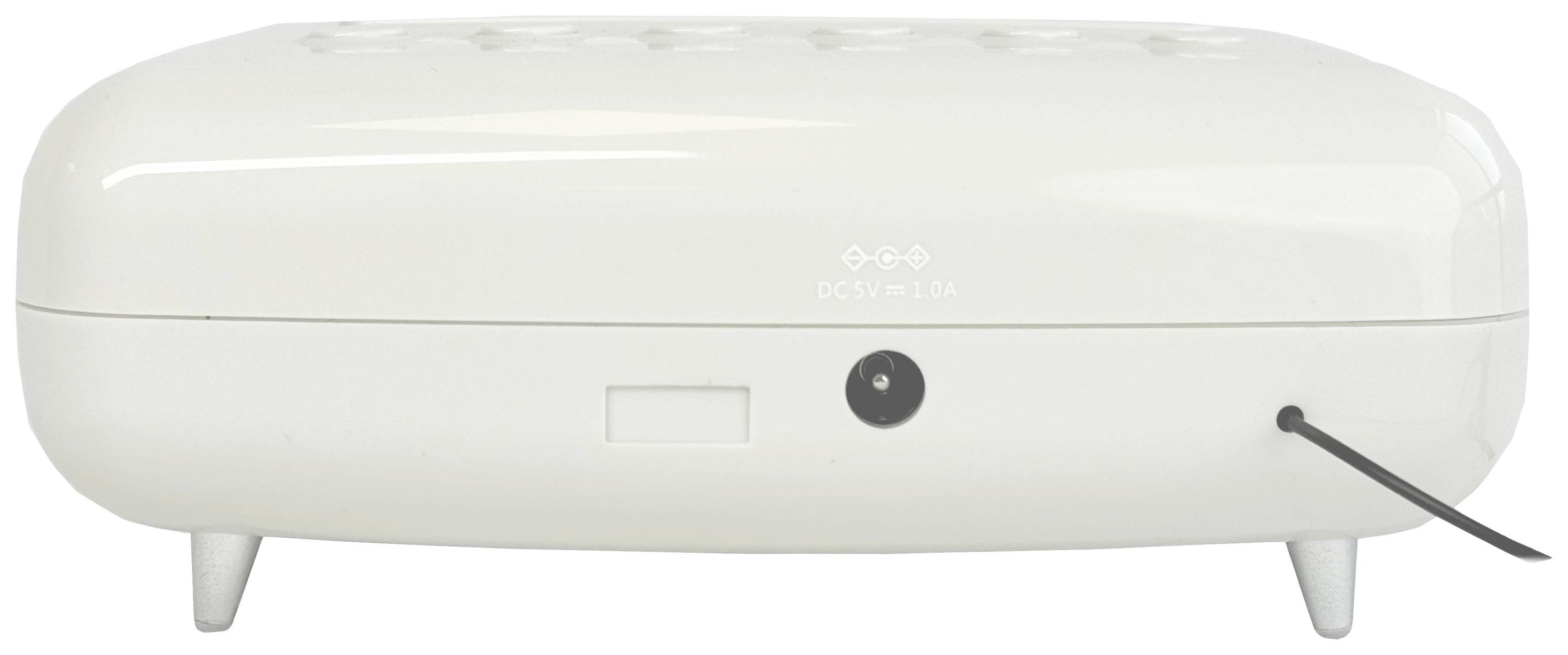 Ein weißes, rechteckiges Elektrogerät mit runden Kanten, Steckerbuchse auf der Rückseite; auf kleinen Füßen stehend.