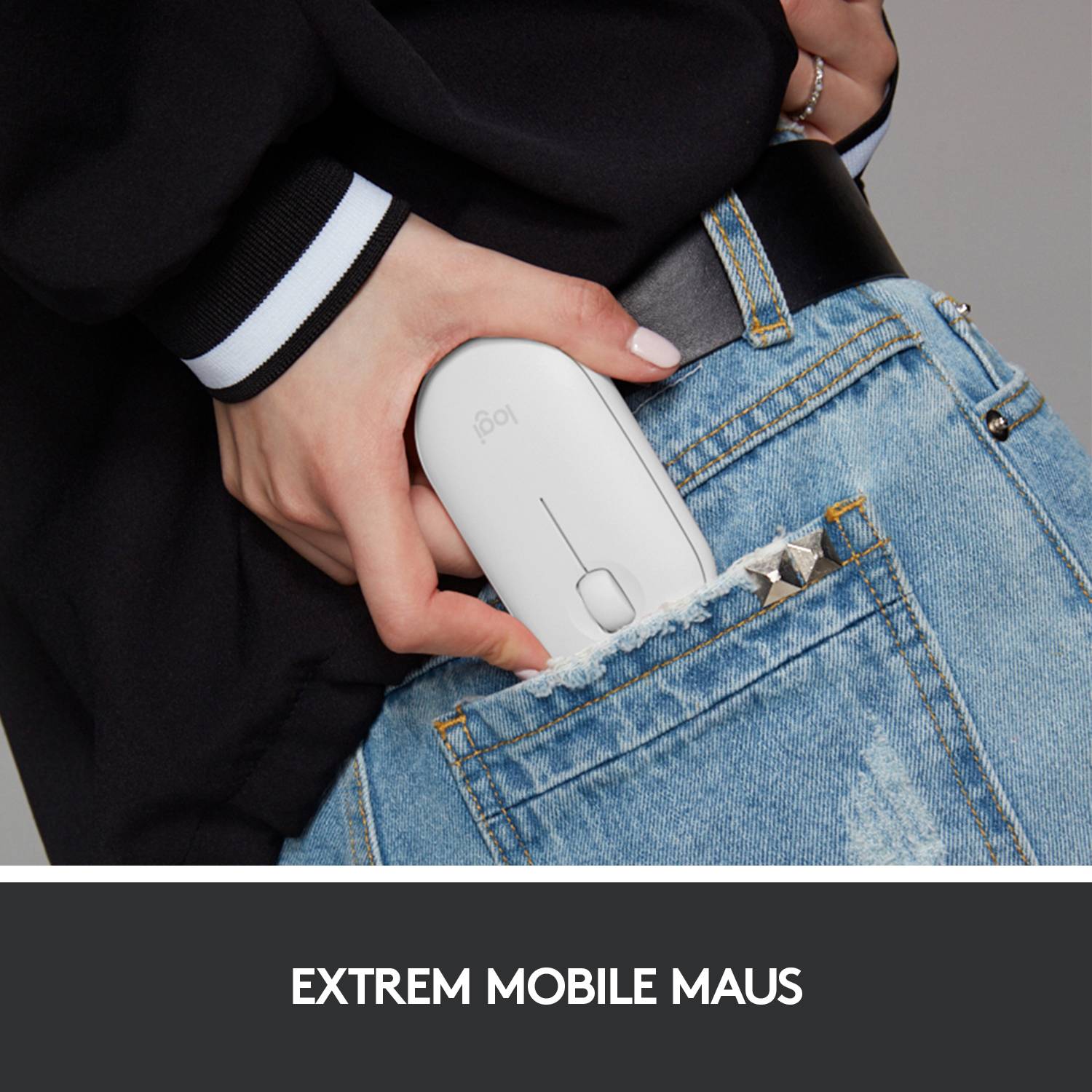 Person zieht eine weiße Computermaus aus einer Jeans-Tasche. Unter dem Bild steht der Text 'EXTREM MOBILE MAUS'.
