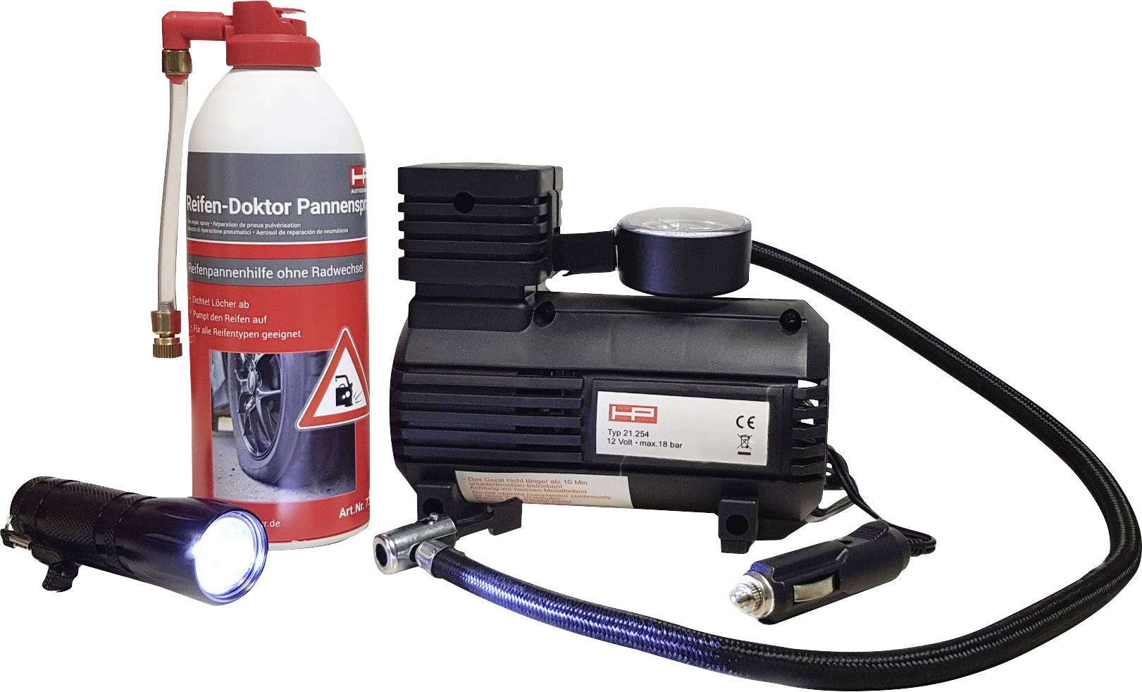Ein Reifenreparaturset mit einer Flasche Dichtmittel, einem Kompressor und einer Taschenlampe, zur schnellen Behebung von Reifenpannen.