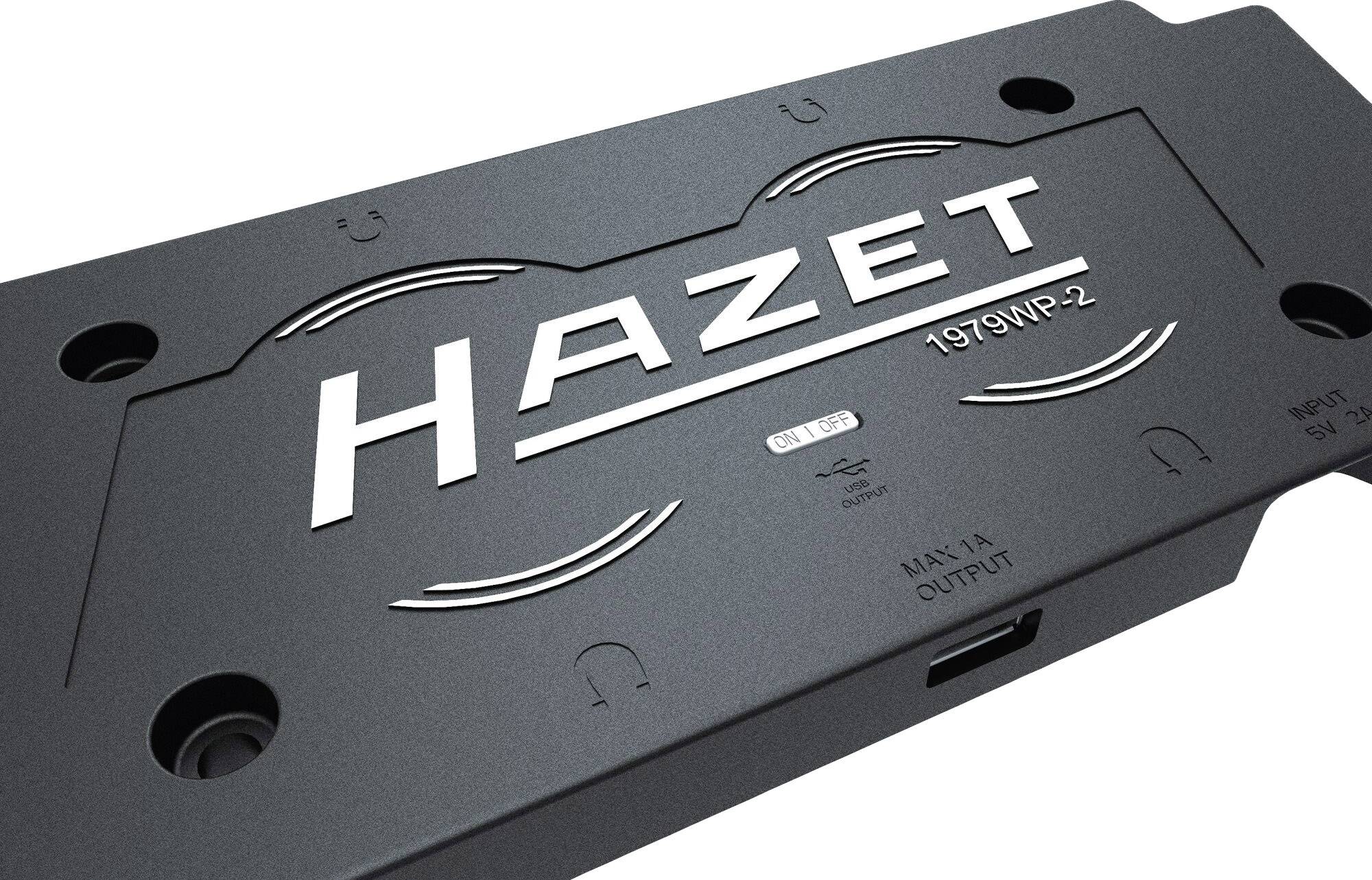 Ein schwarzes Gerät mit der Aufschrift 'HAZET 1979WP-2' auf der Oberseite, umgeben von Schraubenlöchern und einem USB-Anschluss an der Seite.