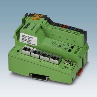 Grünes elektrisches Steuergerät mit mehreren Anschlüssen, Etikett mit technischen Spezifikationen, auf grauem Hintergrund.