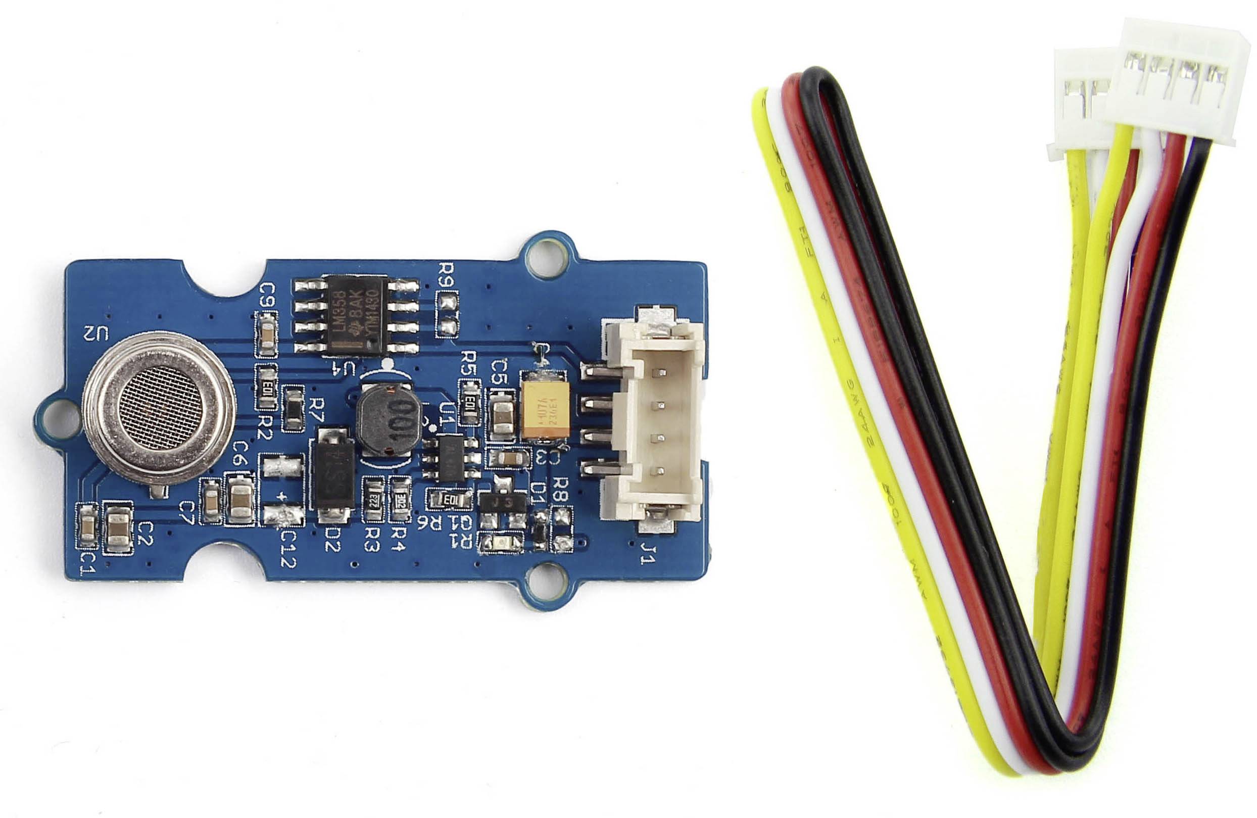 Ein Elektronikmodul mit Sensor und angeschlossenem Kabelbaum. Das Modul hat mehrere elektronische Komponenten auf einer Leiterplatte.