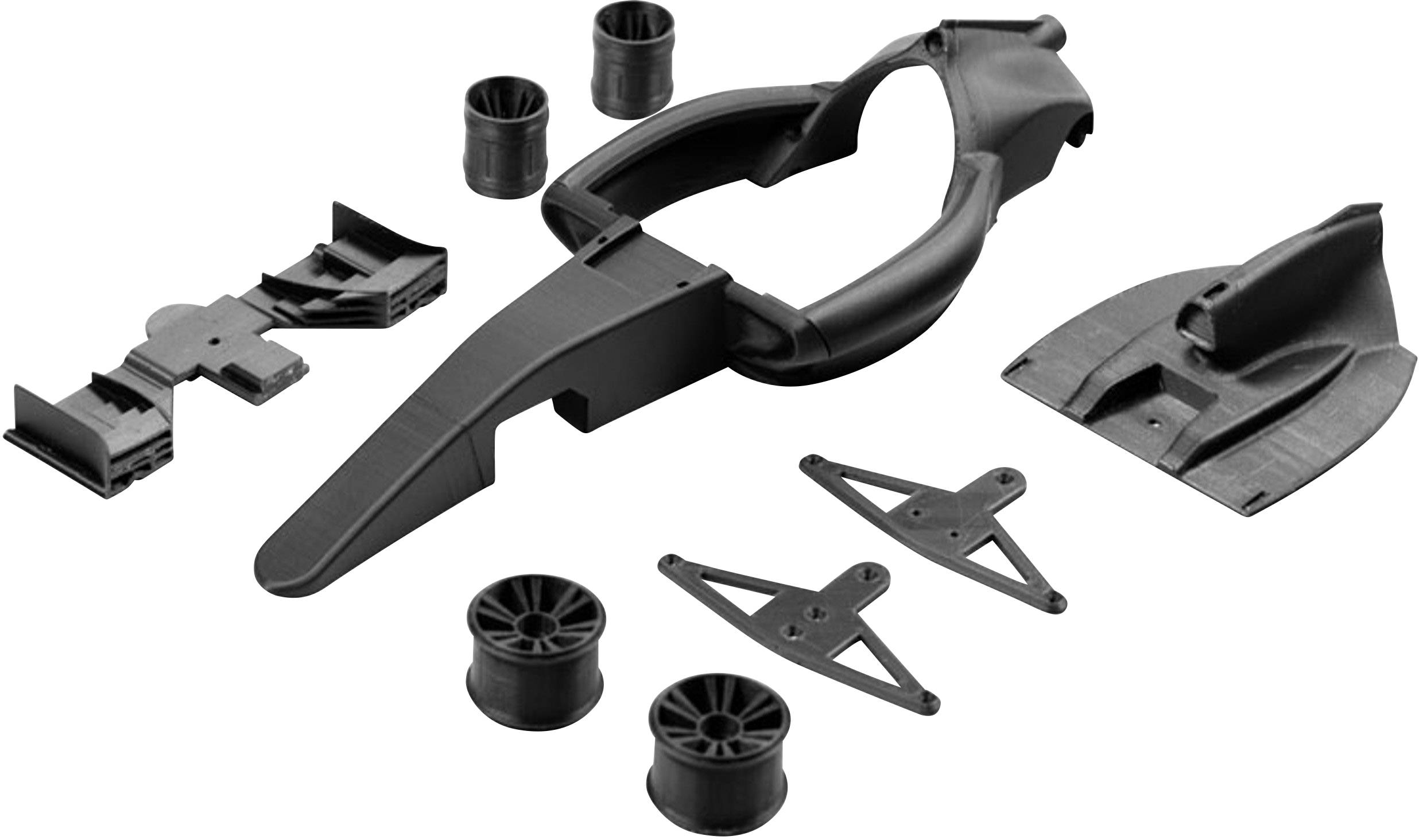 Ein Set mehrerer schwarzer Kunststoffteile für den Modellbau, darunter ein Rahmen, Räder und Flügel.