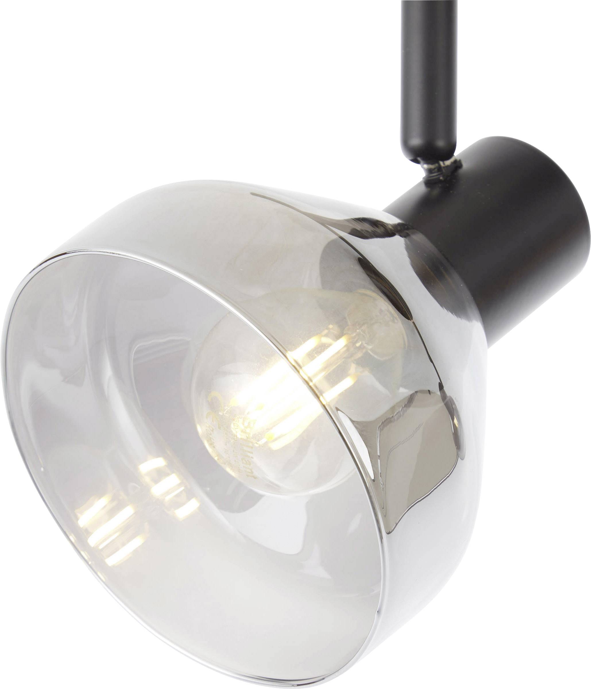 Eine moderne, hängende Lampe mit einer transparenten Glaskuppel und sichtbarer Glühbirne, leuchtet warmes Licht aus.