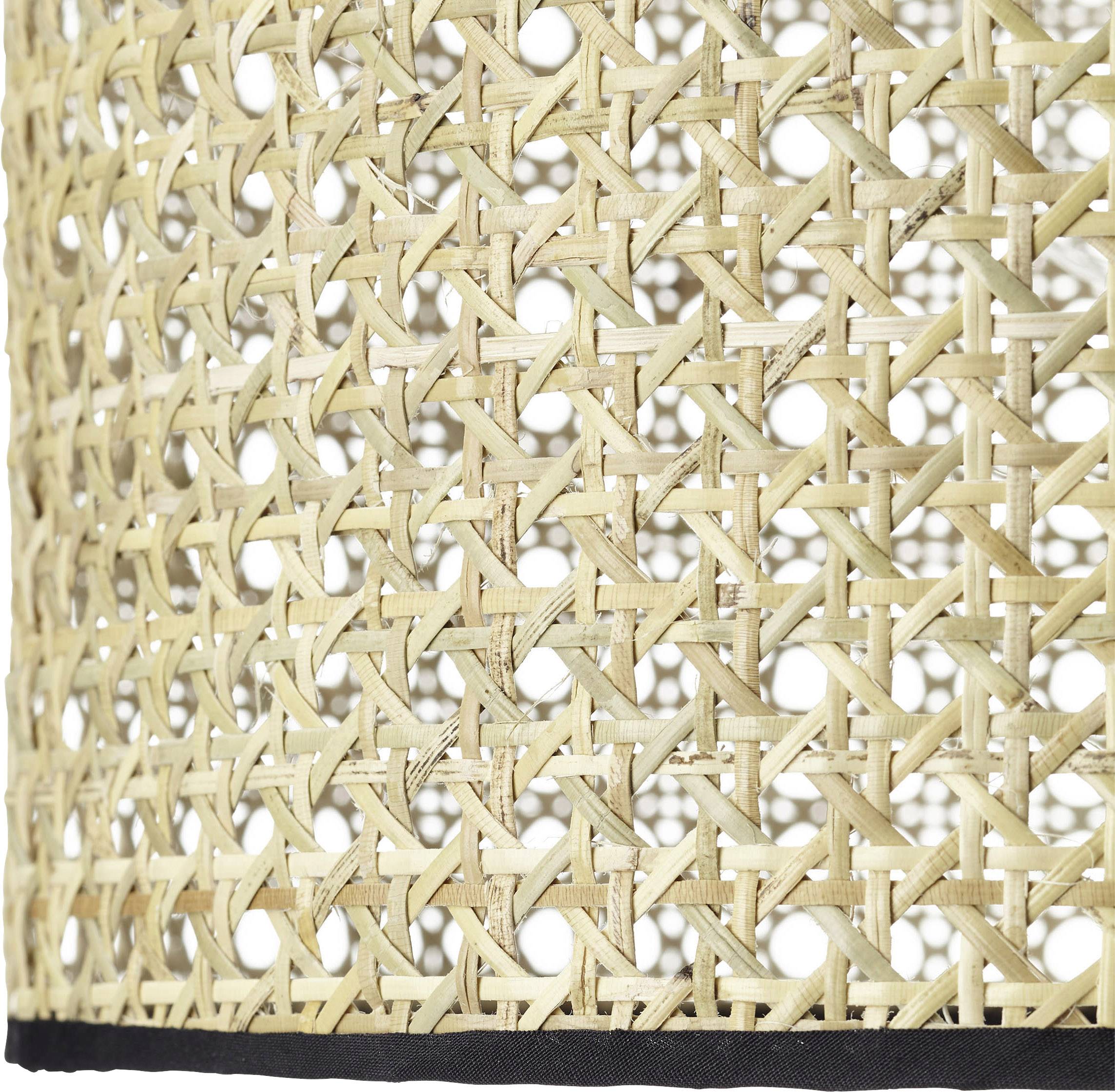 Ein close-up Bild eines gewebten Rattan-Materials, das eine natürliche beige Farbe hat.