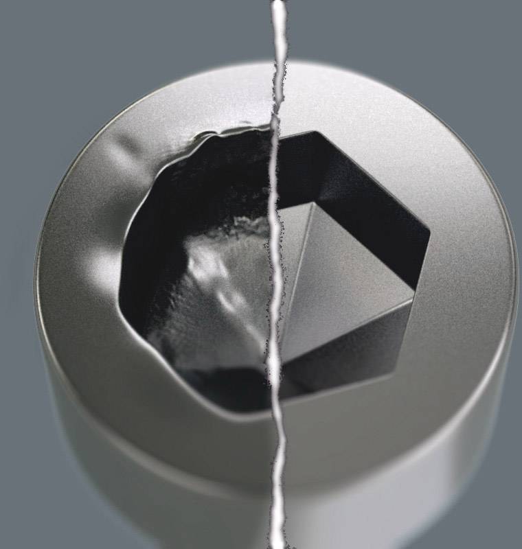 Eine graue, zylinderförmige Oberfläche mit einer unregelmäßigen, vertieften Form in der Mitte, getrennt durch eine diagonale Linie.