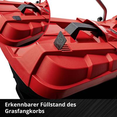 Roter Grasfangkorb mit sichtbarem Füllstandsanzeiger auf einem Rasenmäher. Der Griff ist schwarz und gut sichtbar.