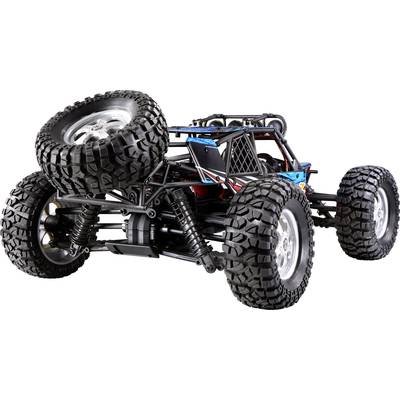 Ein ferngesteuertes Offroad-Fahrzeug mit großen, grobstolligen Reifen, robustem Chassis und sichtbarer Federung.