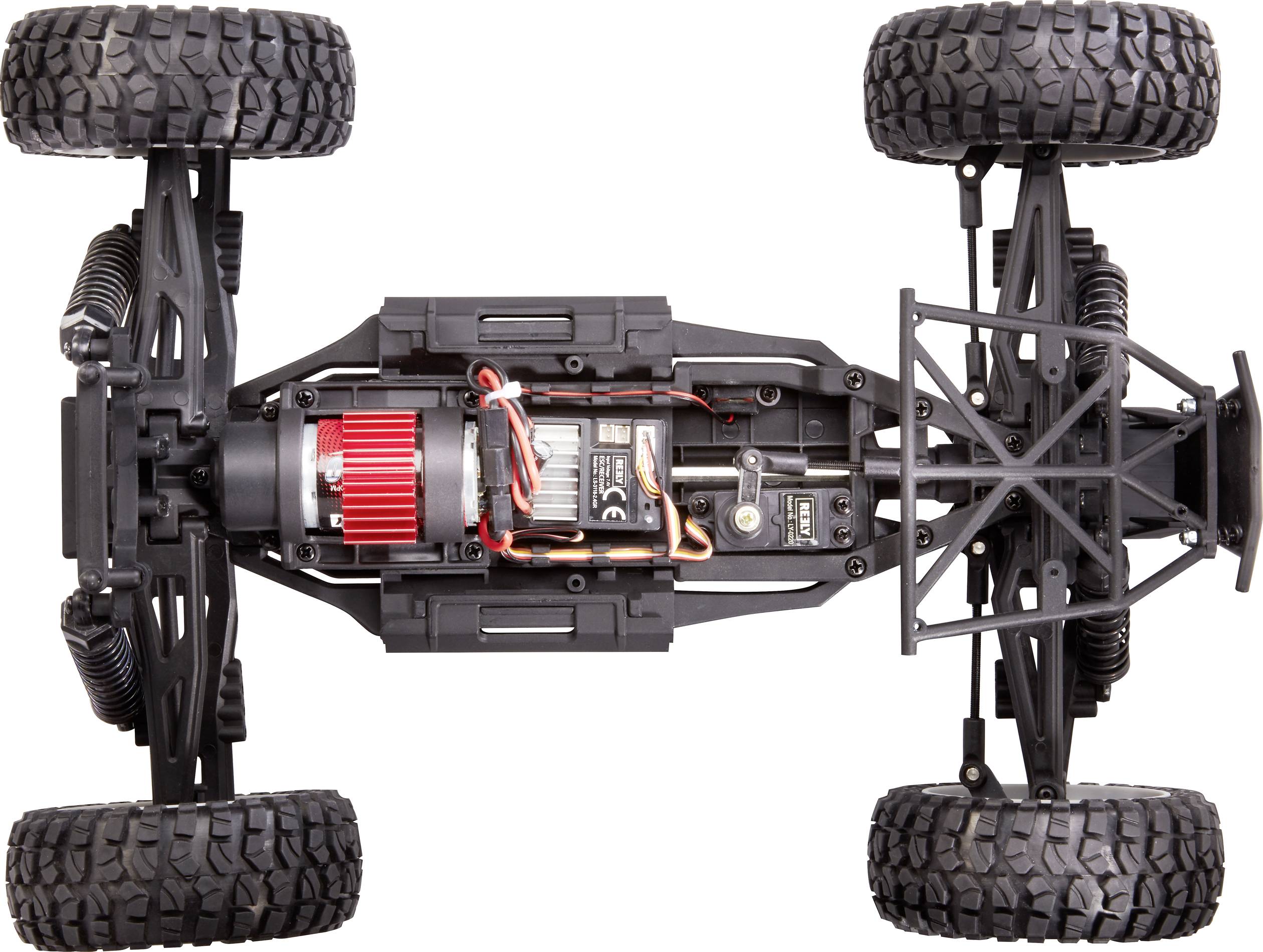 Das Bild zeigt die Unterseite eines ferngesteuerten Autos mit sichtbar detaillierter Federung und Reifen. Elektronische Komponenten sind erkennbar.