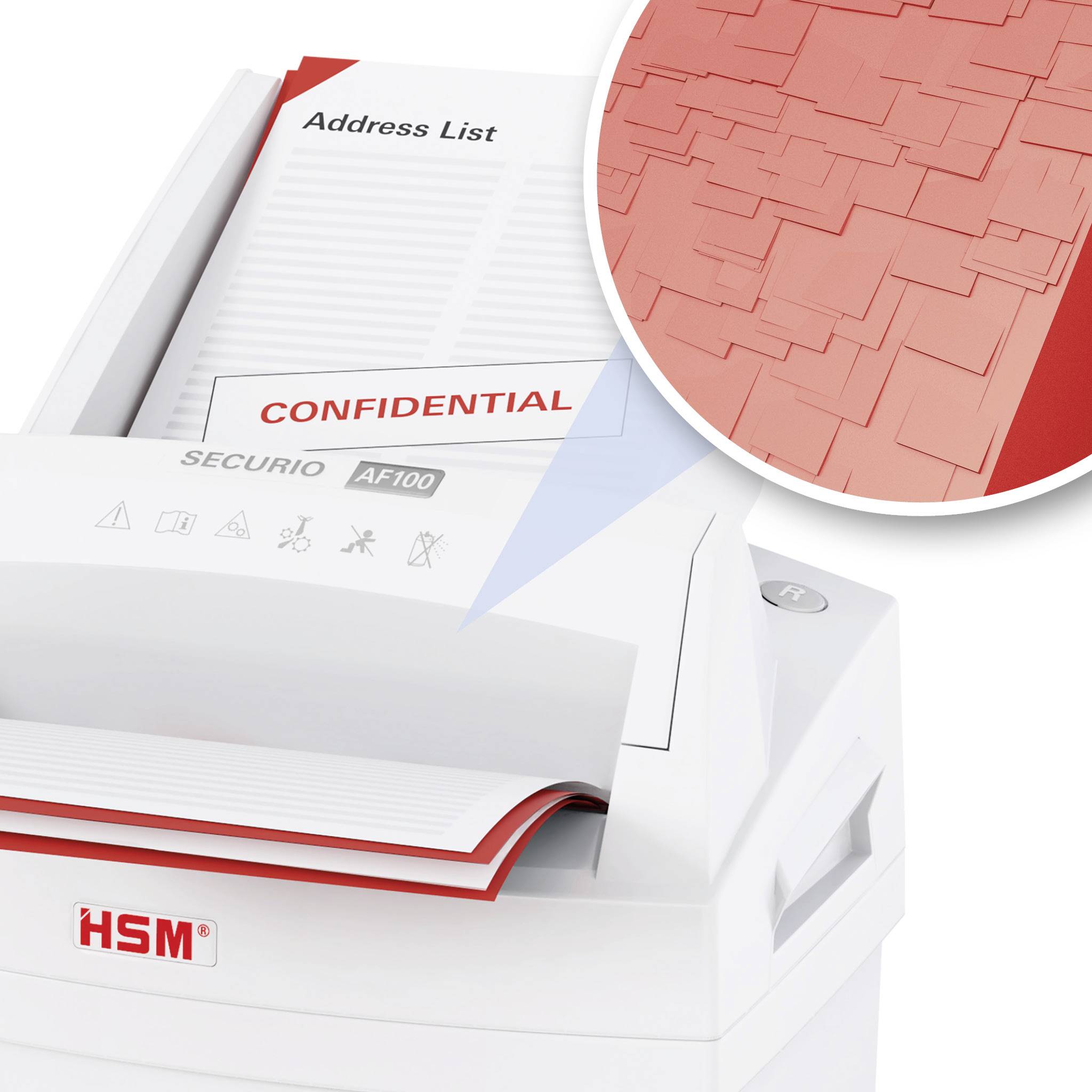 Ein Aktenvernichter zerkleinert ein Dokument mit der Aufschrift 'Confidential'. Nahaufnahme zeigt die zerschnittenen Papierstreifen.