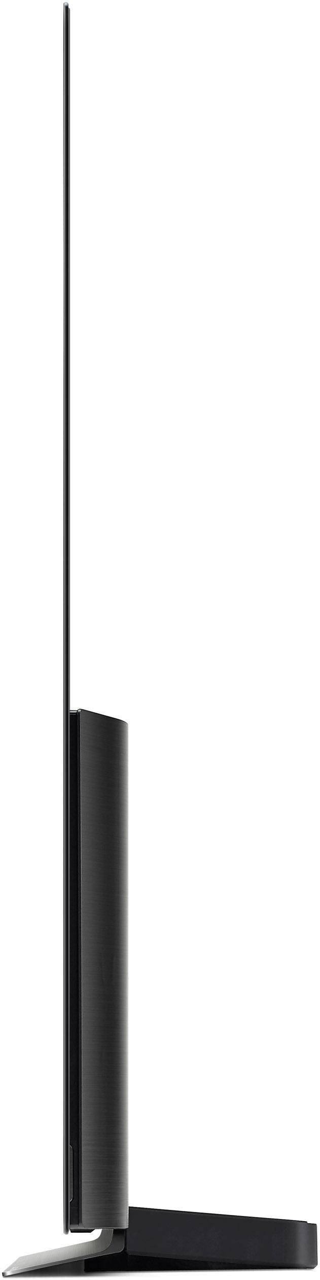 Seitenansicht eines ultradünnen Fernsehers auf einem Standfuß. Der Bildschirm ist extrem schmal, fast flach, eingesteckt in eine Basis.