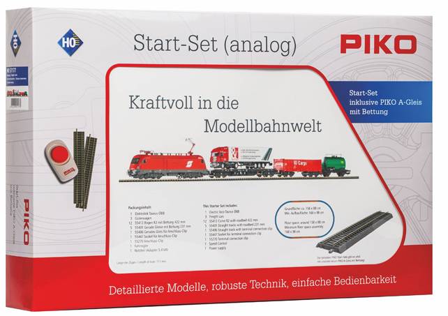 „Start-Set (analog)" Modelleisenbahn-Bausatz-Schachtel mit einem roten Zug, Gleisabschnitten und dem Text „Kraftvoll in die Modellbahnwelt."