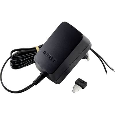 Schwarzes Netzteil mit Kabel und zwei offenen Drahtenden. Daneben liegt ein kleiner Metalladapter.