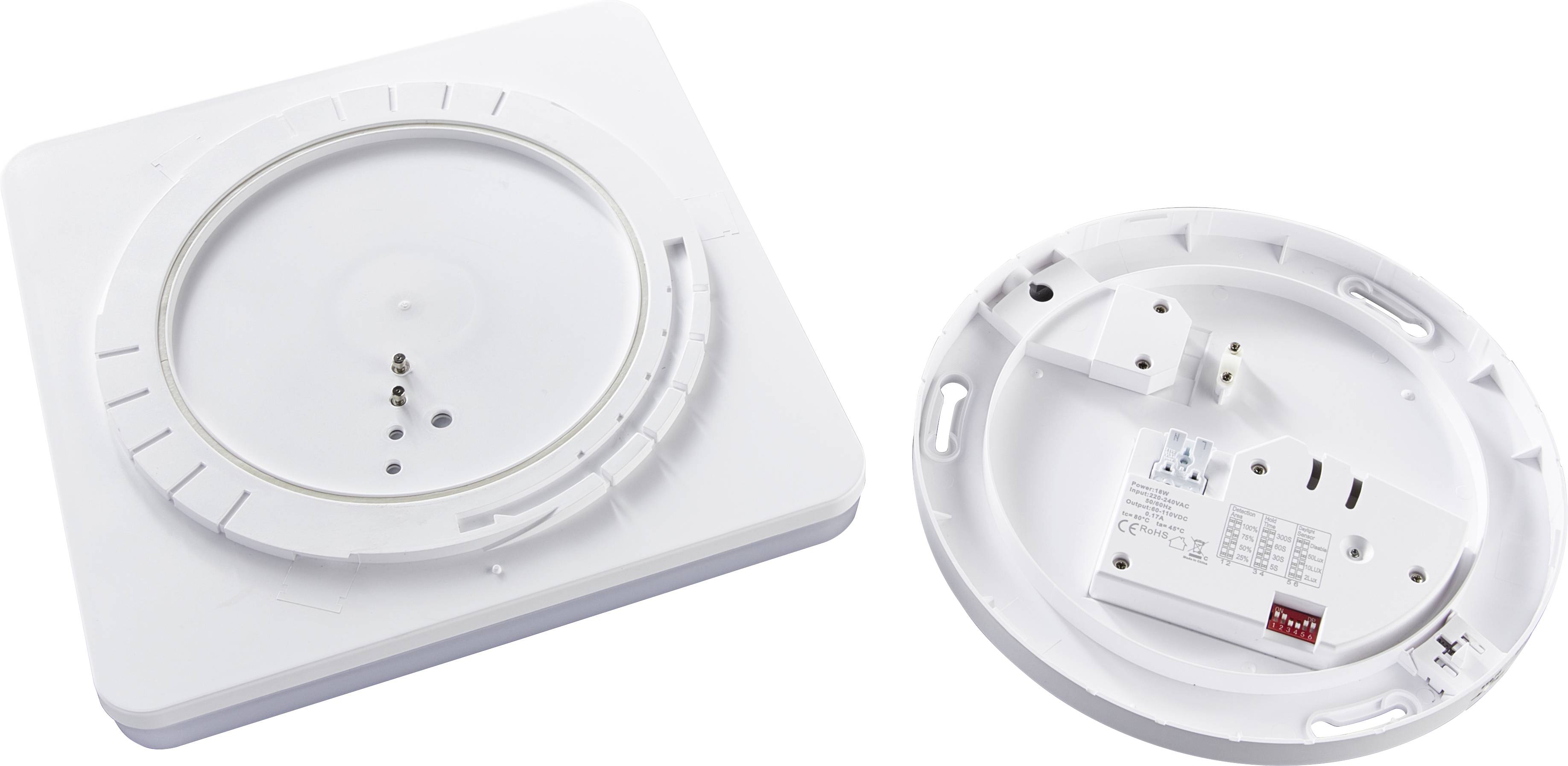 Zwei weiße, runde Kunststoffteile mit Befestigungslöchern und elektronischen Komponenten. Vermutlich Teile eines Rauchmelders.