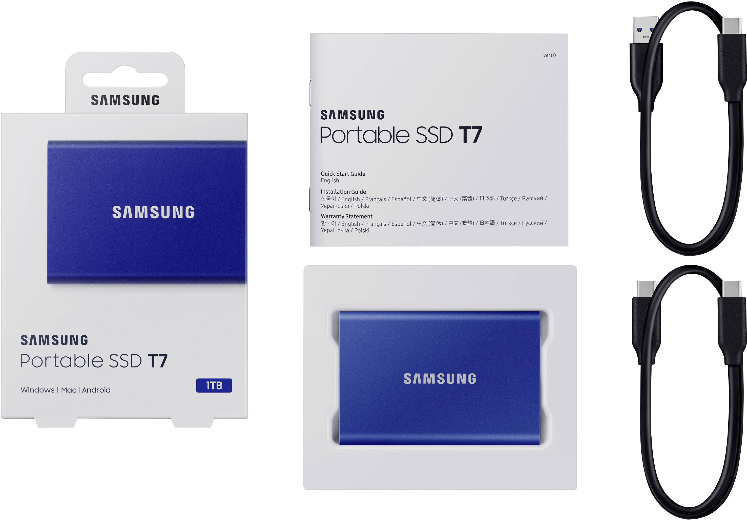 Verpackung und Inhalt eines tragbaren Samsung SSD T7 1TB: blaue Festplatte, Benutzerhandbuch, USB-C- und USB-A-Kabel. Kompatibel mit Windows, Mac, Android.