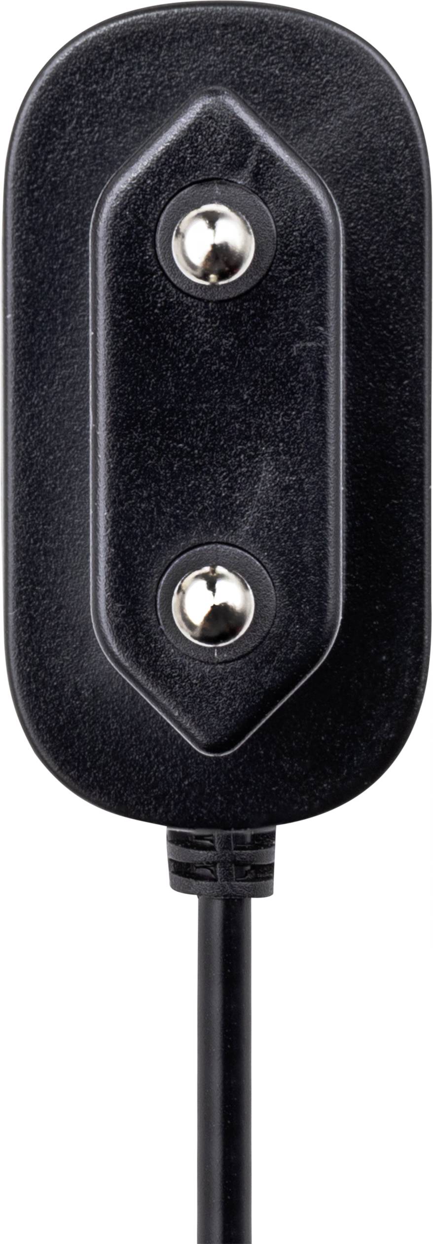 Ein schwarzer elektrischer Stecker mit zwei sichtbaren Metallpins und einem Kabel unten.
