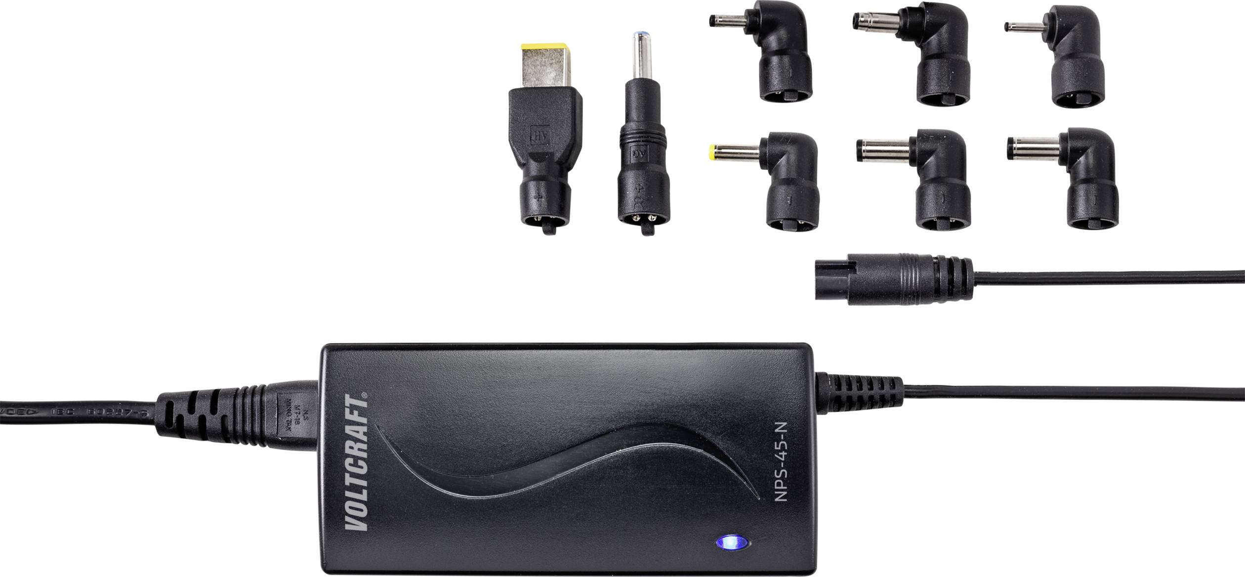 Schwarzes Voltcraft-Netzteil mit sechs austauschbaren Adaptern und USB-Stecker zum Laden verschiedener Geräte.