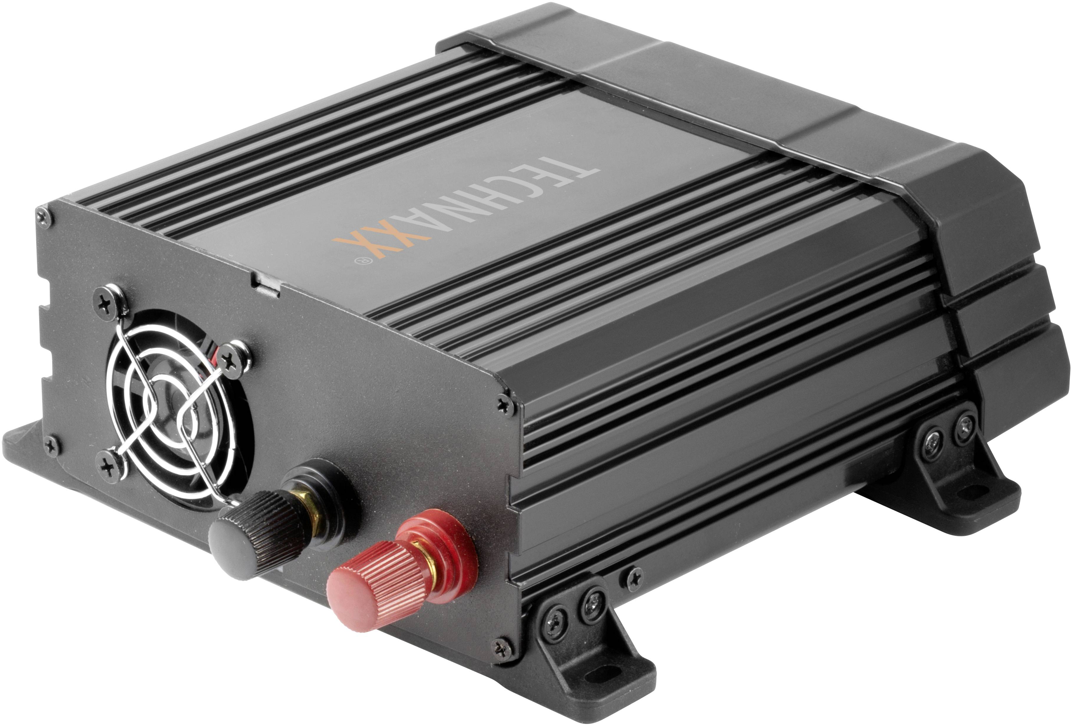 Ein schwarzes, rechteckiges Gerät mit Kühlrippen und Lüfter, ausgestattet mit roten und schwarzen Anschlussklemmen, liegt auf einer Oberfläche.