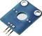 Ein rechteckiges, blaues Elektronikmodul mit drei Steckpins und drei Befestigungspunkten.