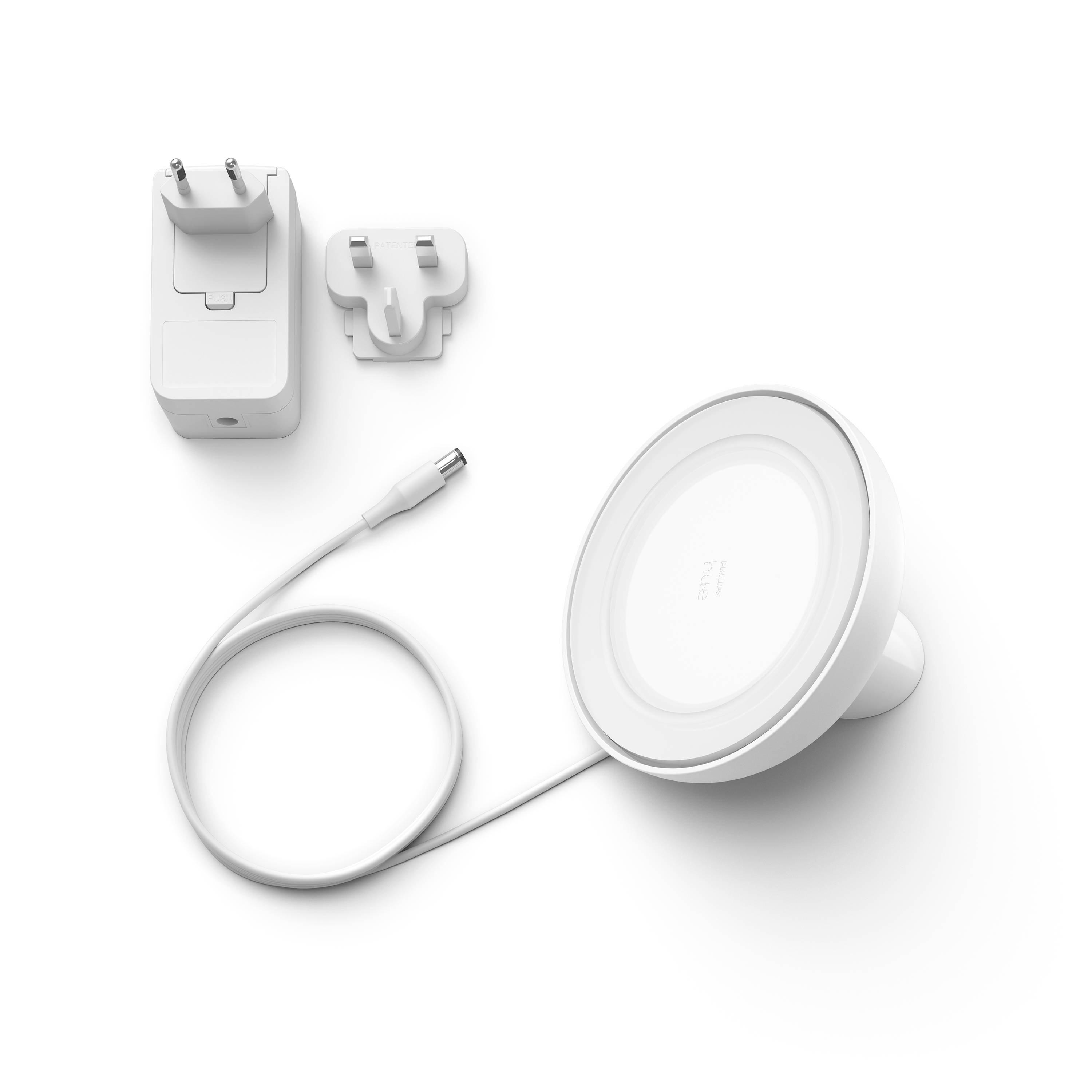 Ein rundes LED-Licht mit einem Ladekabel und Netzteil, geeignet für die Installation oder Verwendung als mobile Beleuchtungslösung.