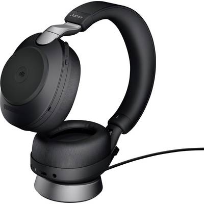 Schwarze, kabellose Over-Ear-Kopfhörer auf einem Ladegerät. Sie wirken modern und ergonomisch, geeignet für Musik oder Telefonate.