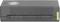 Schwarzer elektronischer Adapter mit Lüftungsschlitzen und einem ovalen Logo auf der Oberseite.