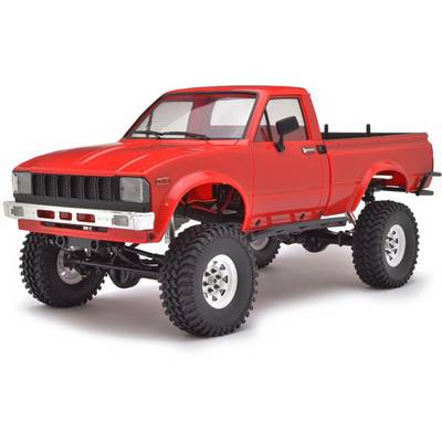 Rotes Modellauto eines Geländewagens mit großen Offroad-Reifen, stilisiert für Abenteuer- und Outdoor-Enthusiasten.