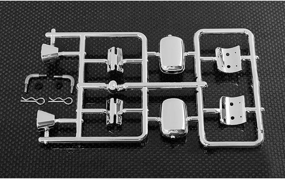 Ein Modellauto-Bauteilrahmen aus Chrom auf schwarzem Hintergrund, bestehend aus mehreren kleinen Autoteilen zur Montage.