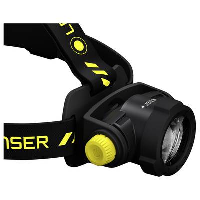 Schwarze Stirnlampe mit gelbem Knopf, montiert auf einem verstellbaren Stirnband. Geeignet für Freizeitanwendungen und Outdoor-Aktivitäten.