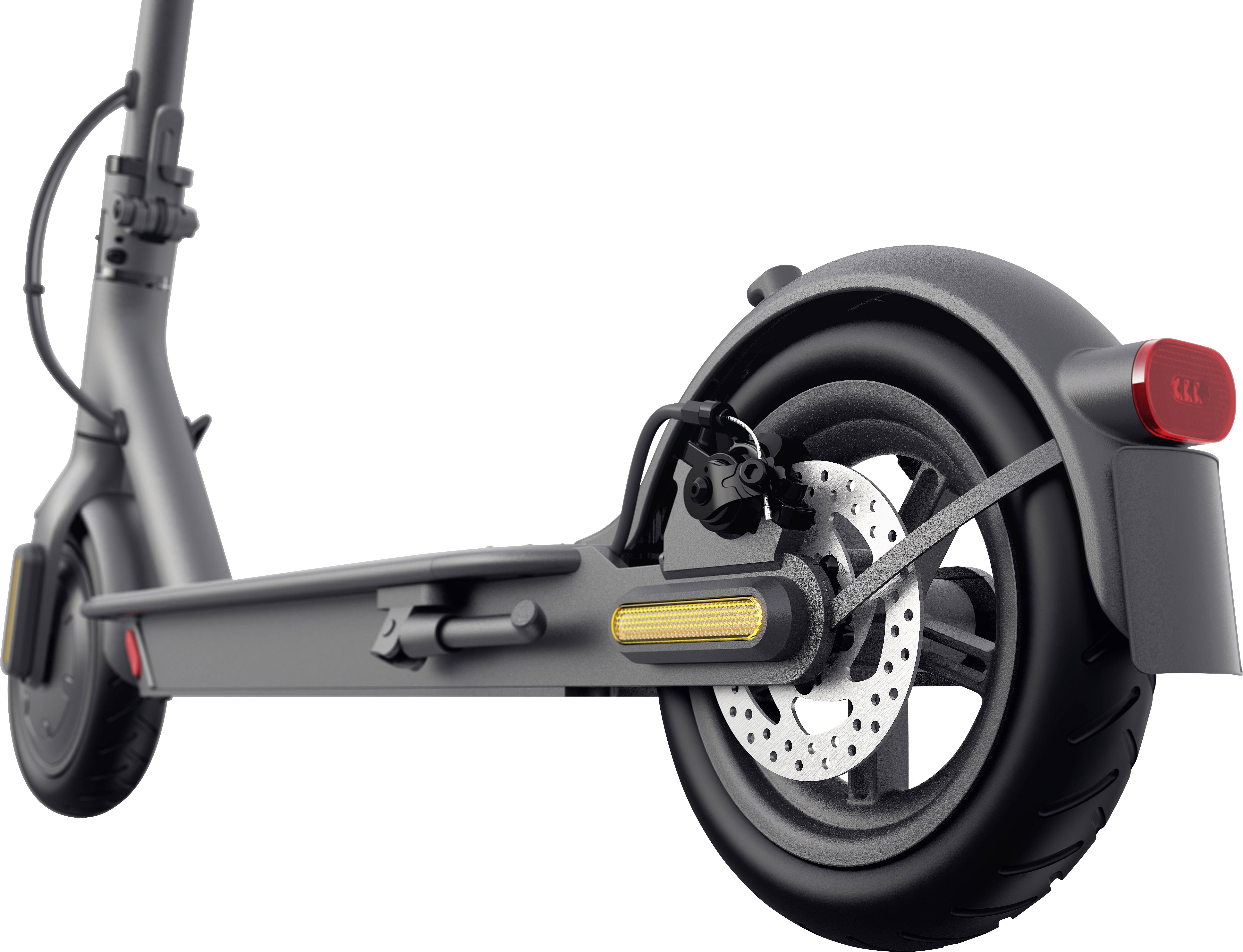 Ein E-Scooter-Rad von der Seite gezeigt. Sichtbar sind der Reifen, die Bremsscheibe und das Rücklicht.