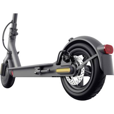 Ein E-Scooter-Rad von der Seite gezeigt. Sichtbar sind der Reifen, die Bremsscheibe und das Rücklicht.