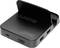 Eine schwarze Dockingstation mit mehreren Anschlüssen, darunter USB-C, HDMI und USB-A, für Smartphone-Verbindung.
