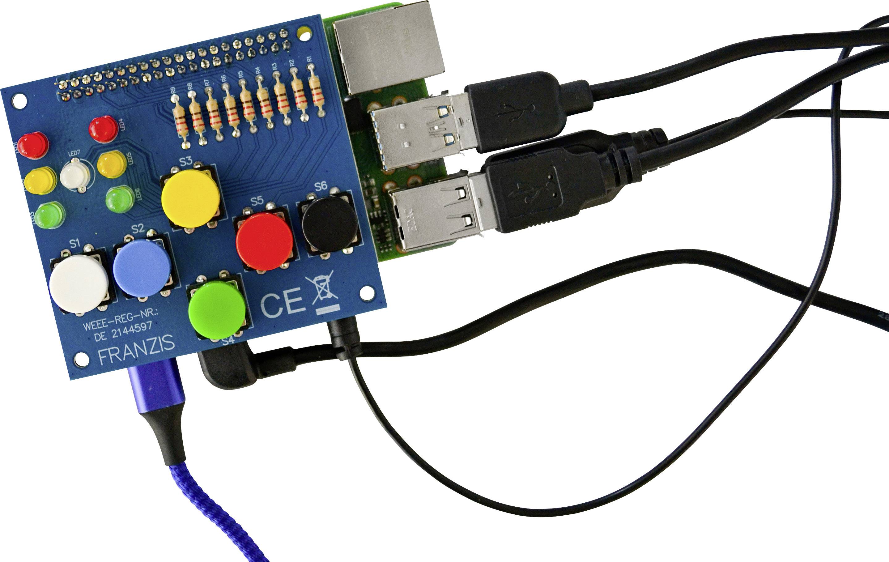 'Eine elektronische Schaltung mit bunten Tasten, LED-Anzeigen und USB-Kabeln. Bildet die Schnittstelle eines kleinen Computergeräts.'