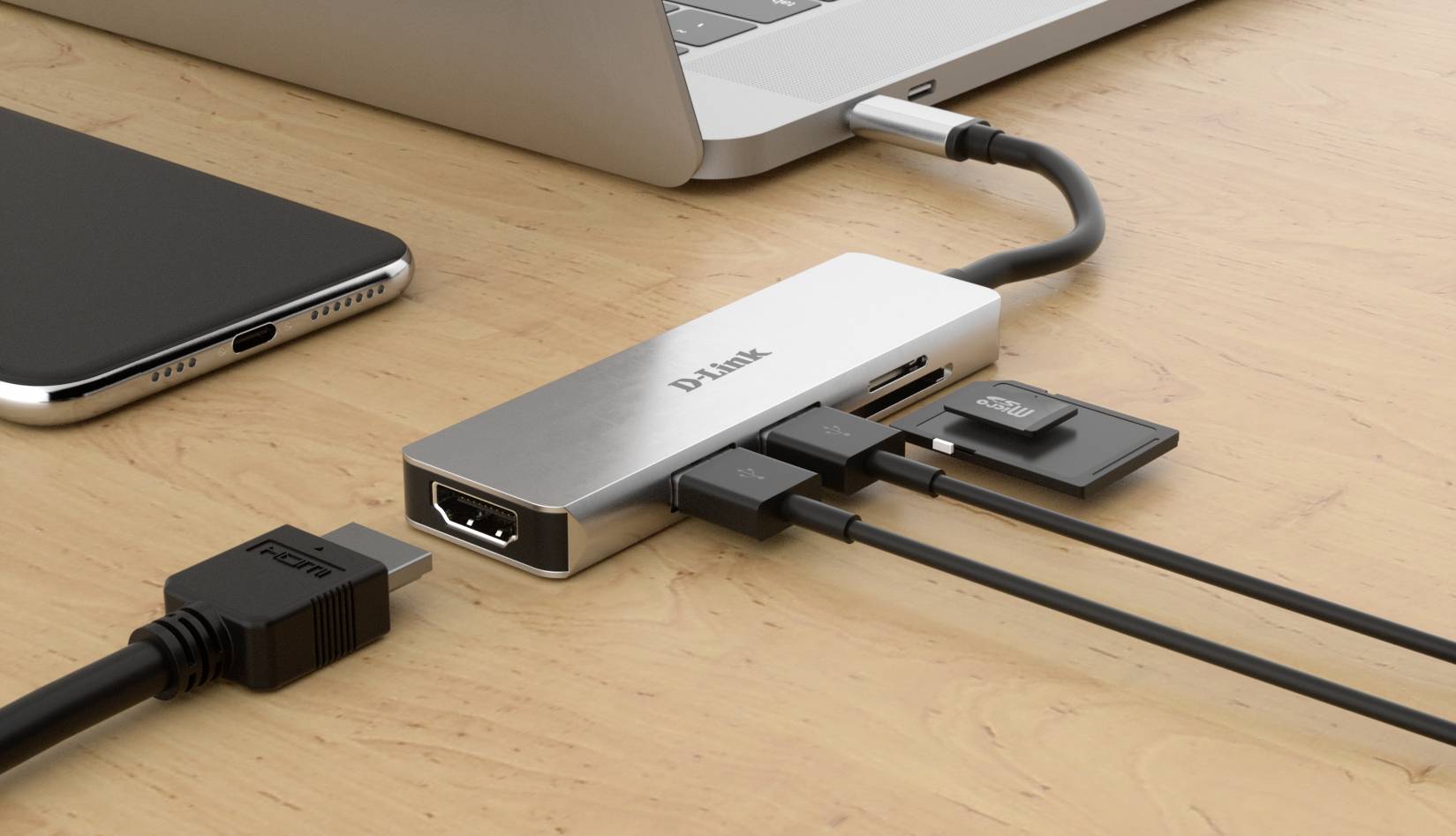 Ein Laptop ist mit einem Multiport-Adapter verbunden, der verschiedene Anschlüsse bietet, darunter HDMI, USB und SD-Kartensteckplätze.